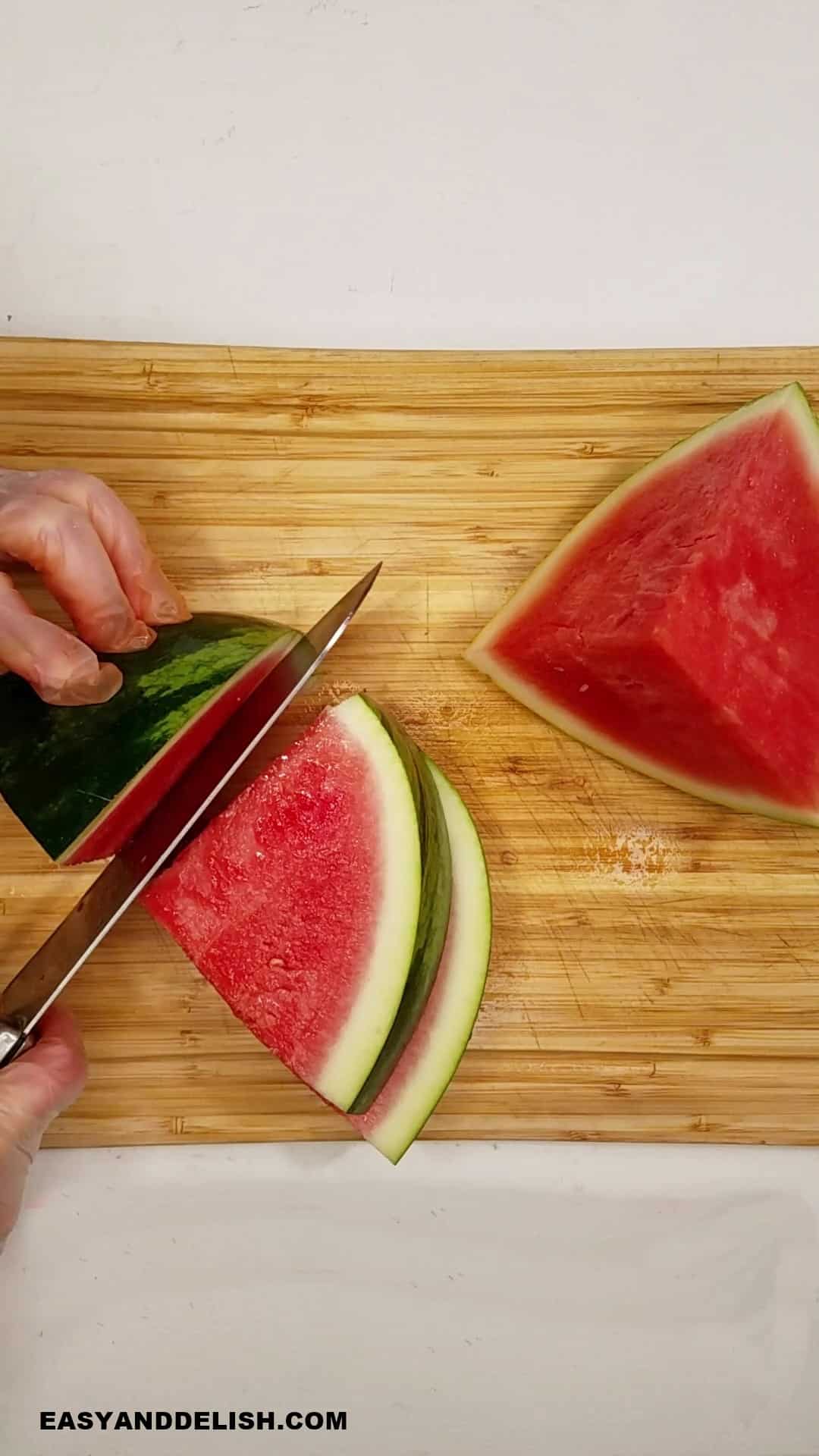 watermelon wedges cut on a cutting board. 