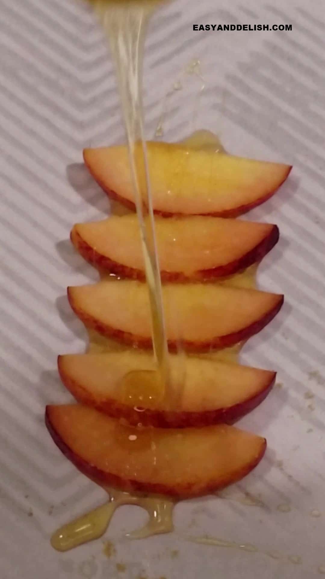 honey drizzled over slices of peach.