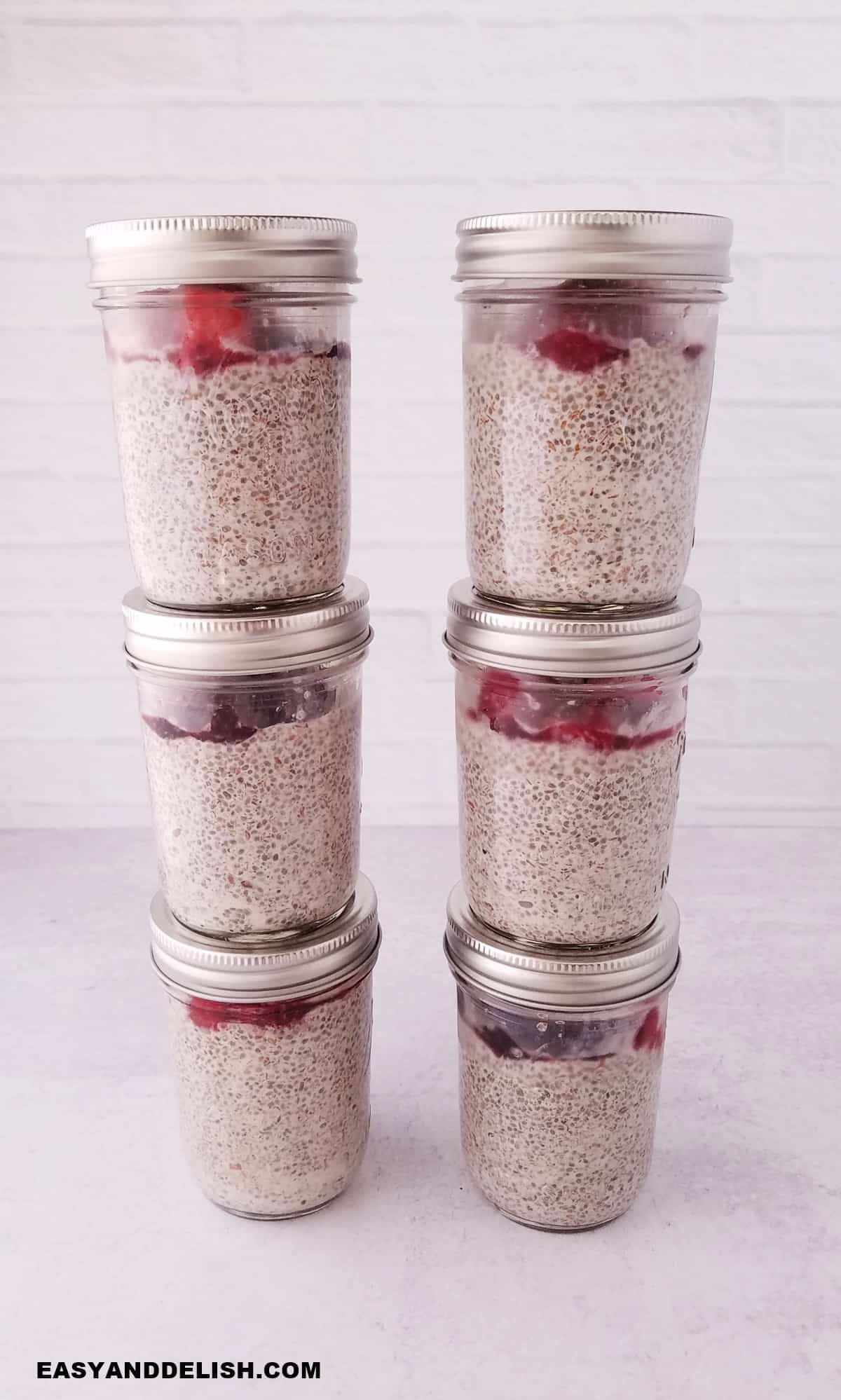 six jars with chia pudding meal prepped for the week.