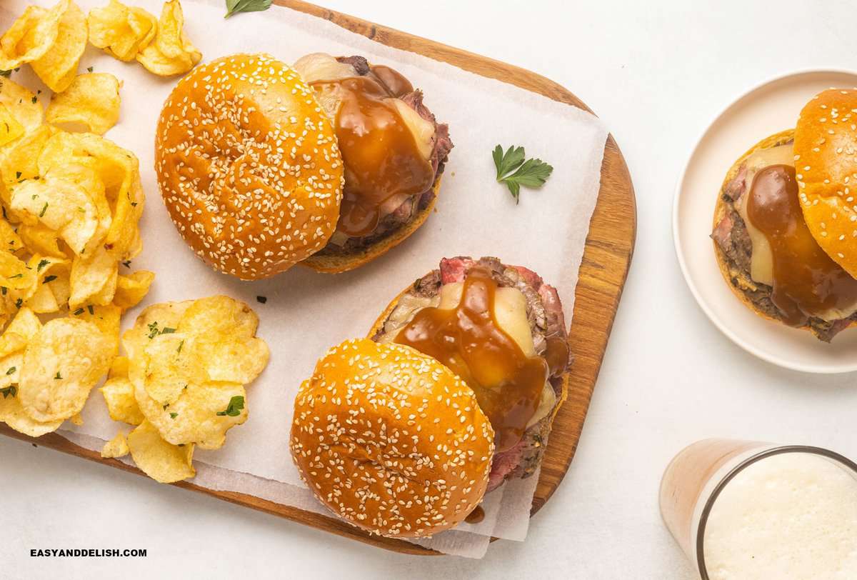 roast beef sandwiches on a cutting board.