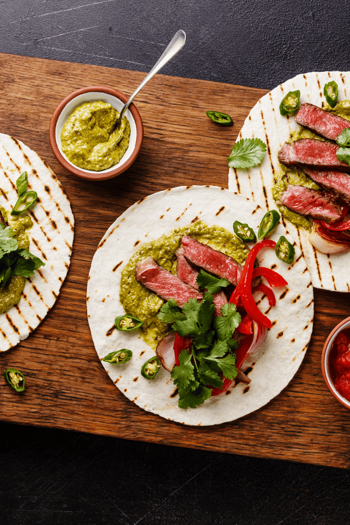 steak tacos over a cutting board