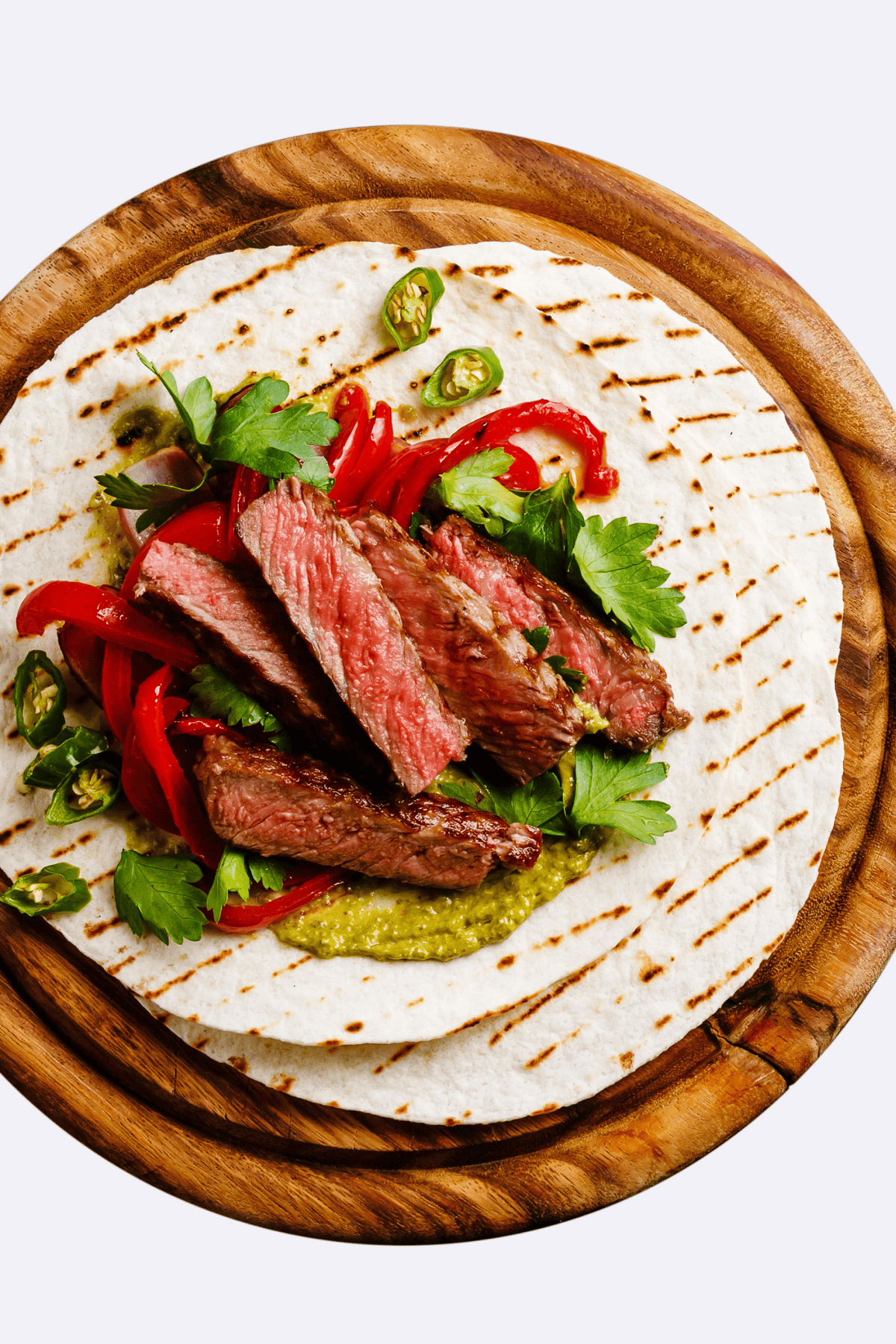 Mexican meat meal served on a round tray.