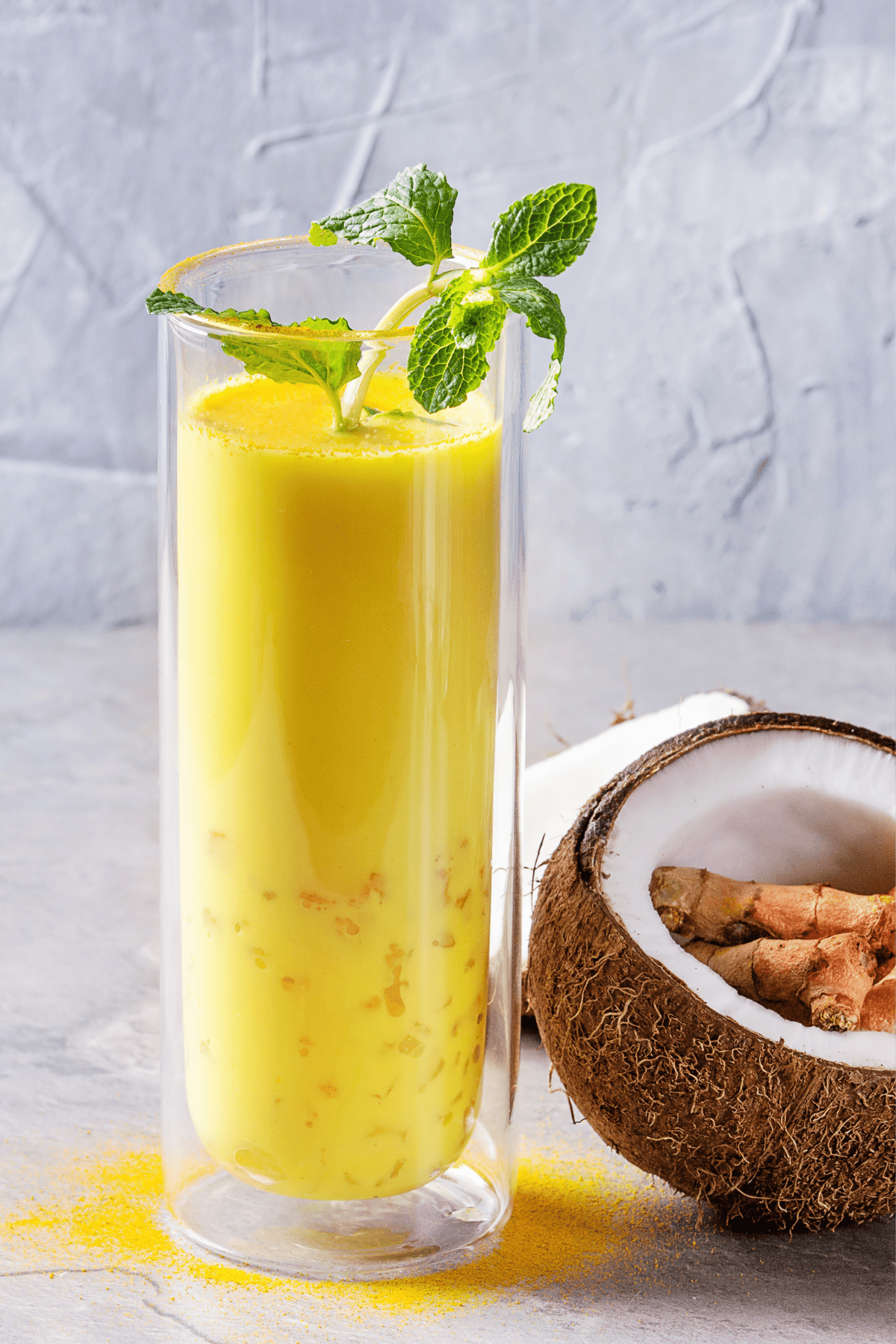 a glass of golden milk made with turmeric and coconut milk plus kefir.
