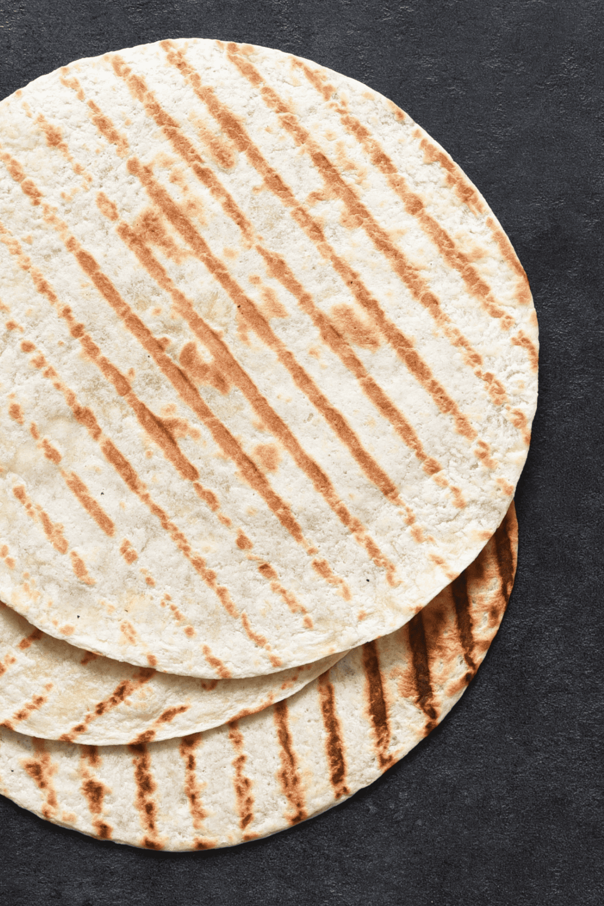 grilled tortillas over a table.