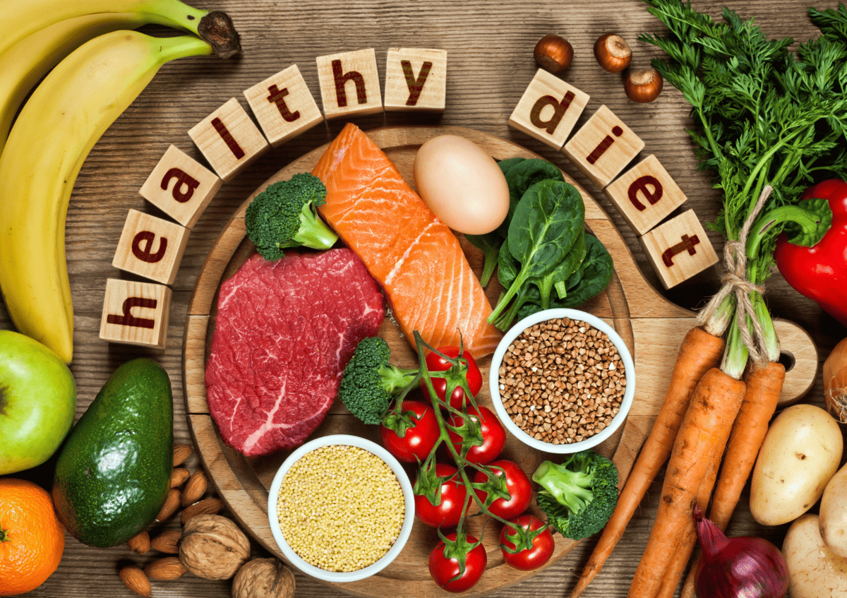 healthy foods or whole foods on a table with a sign written "healthy diet".