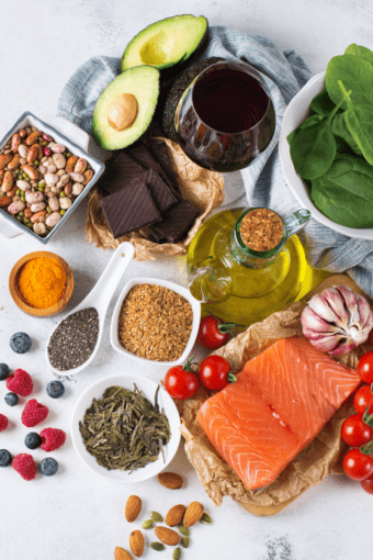 a table with many anti-inflammatory foods to add to your diet.