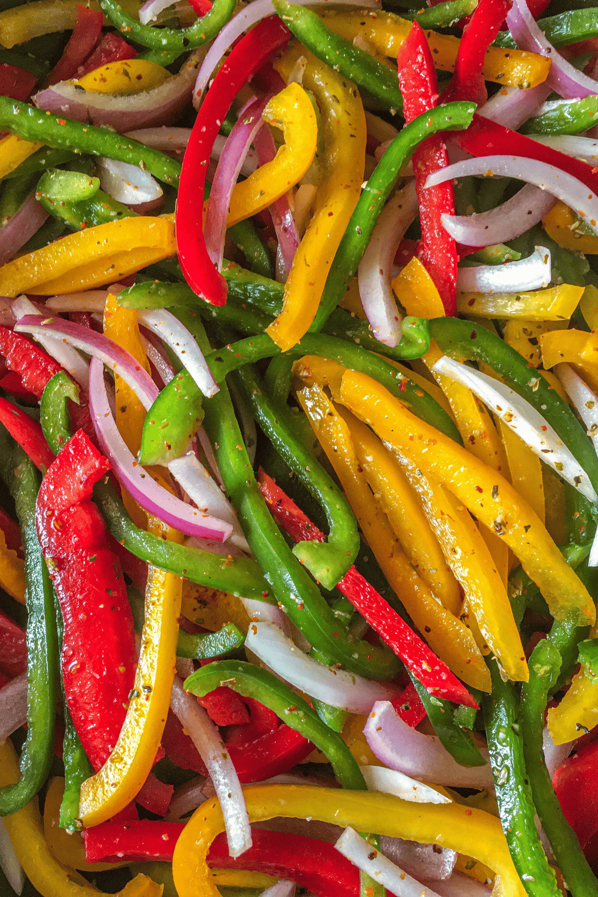 close up of veggie fajitas cooked in a skillet.