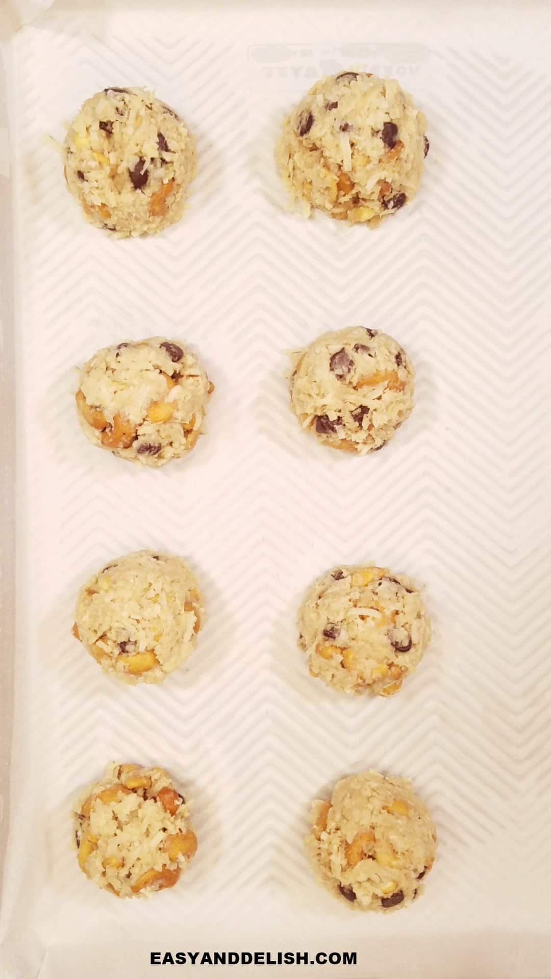 batter scopped onto a baking sheet lined with parchment paper.