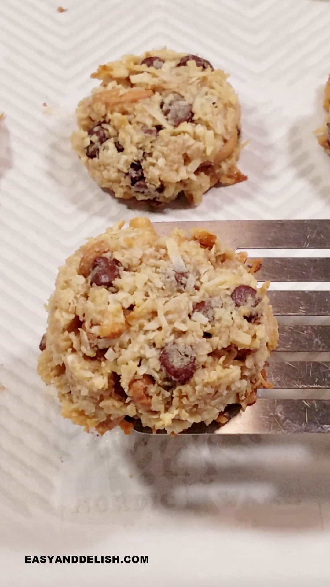 magic bar cookies baked, cooled, and then lifted with a metal spatula.