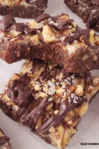 close up of two fig bars, one whole and one bitten partially on top.