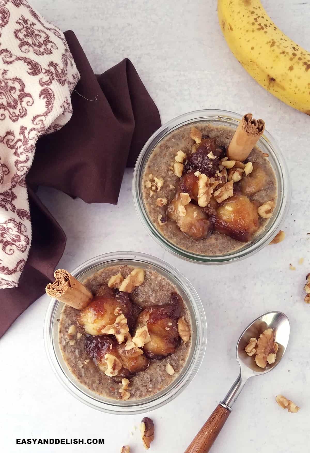 two jars of banana chia seed pudding and a spoon on the side. 