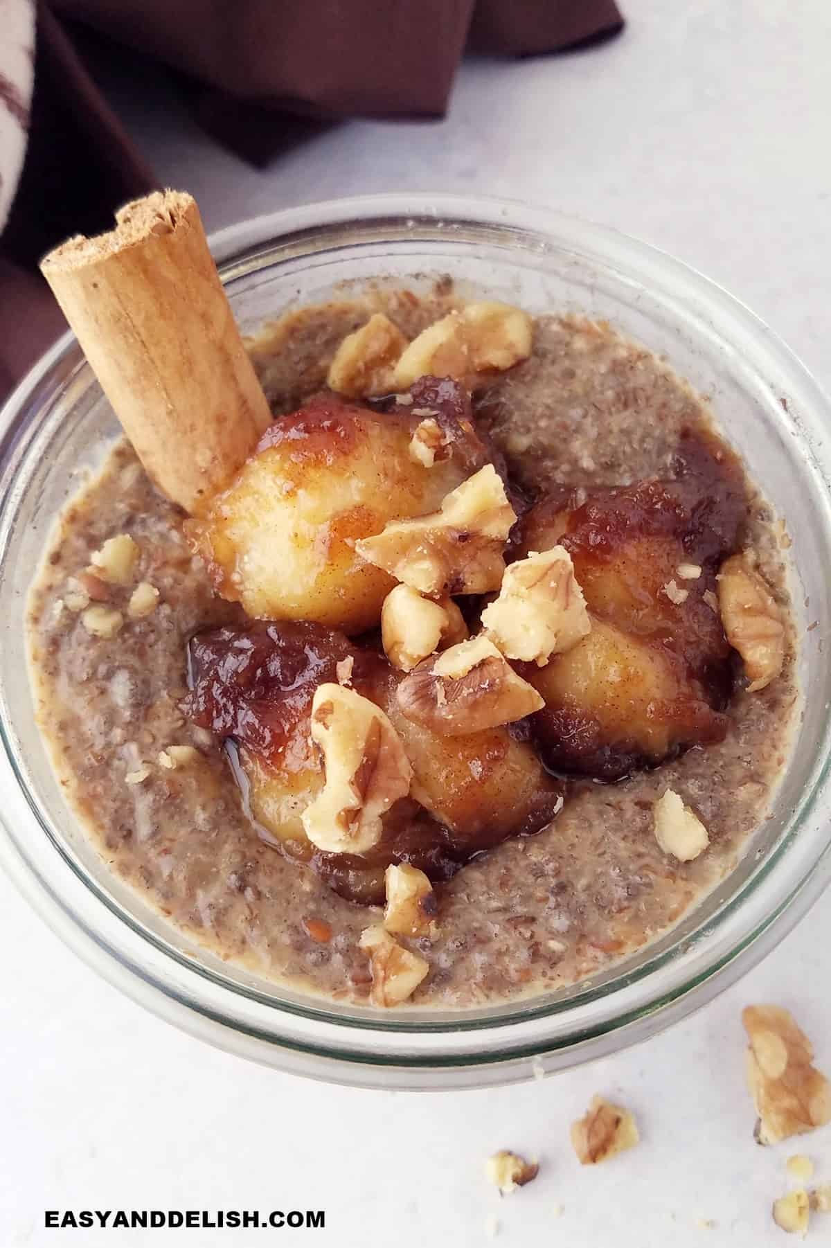 a jar with banana chia pudding with caramelized bananas and walnuts.