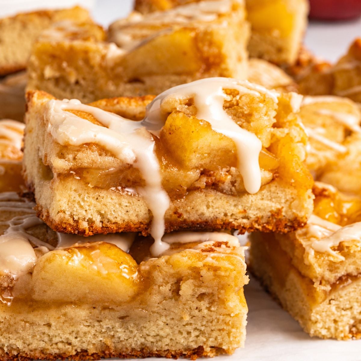 Apple pie bar with juicy apple filling and vanilla glaze.