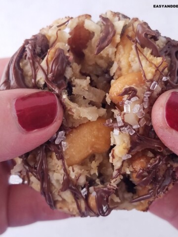 close up of one 7 layer cookie being teared apart.