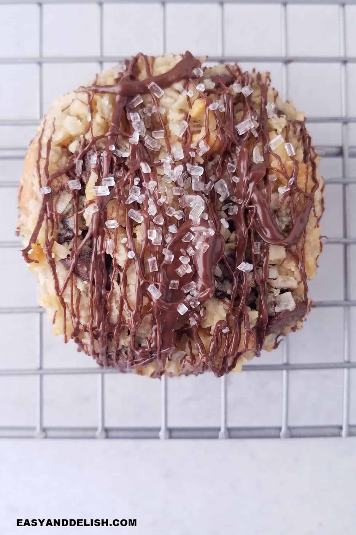 close up of one sevel layer cookie over a cooling rack.