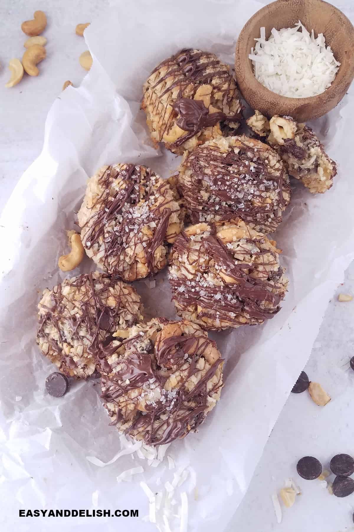 Hello Dolly cookies served in a tray lined with parchment paper. 