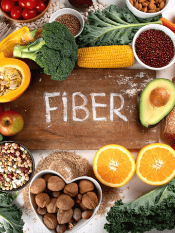 a table full of high fiber foods with a sign that says 'fiber".