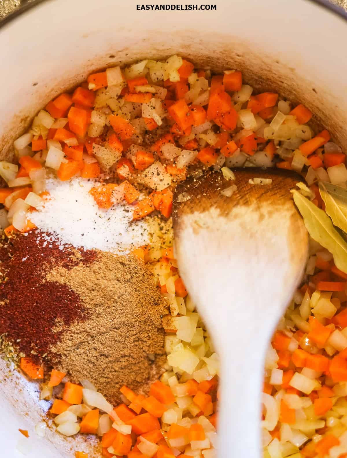 Vegetables with spices cooking in a pot. 