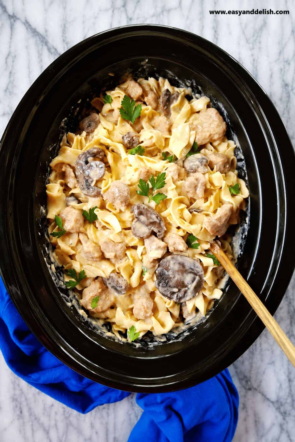 Pork, mushrooms, and egg noodles in a creamy slow cooker sauce.