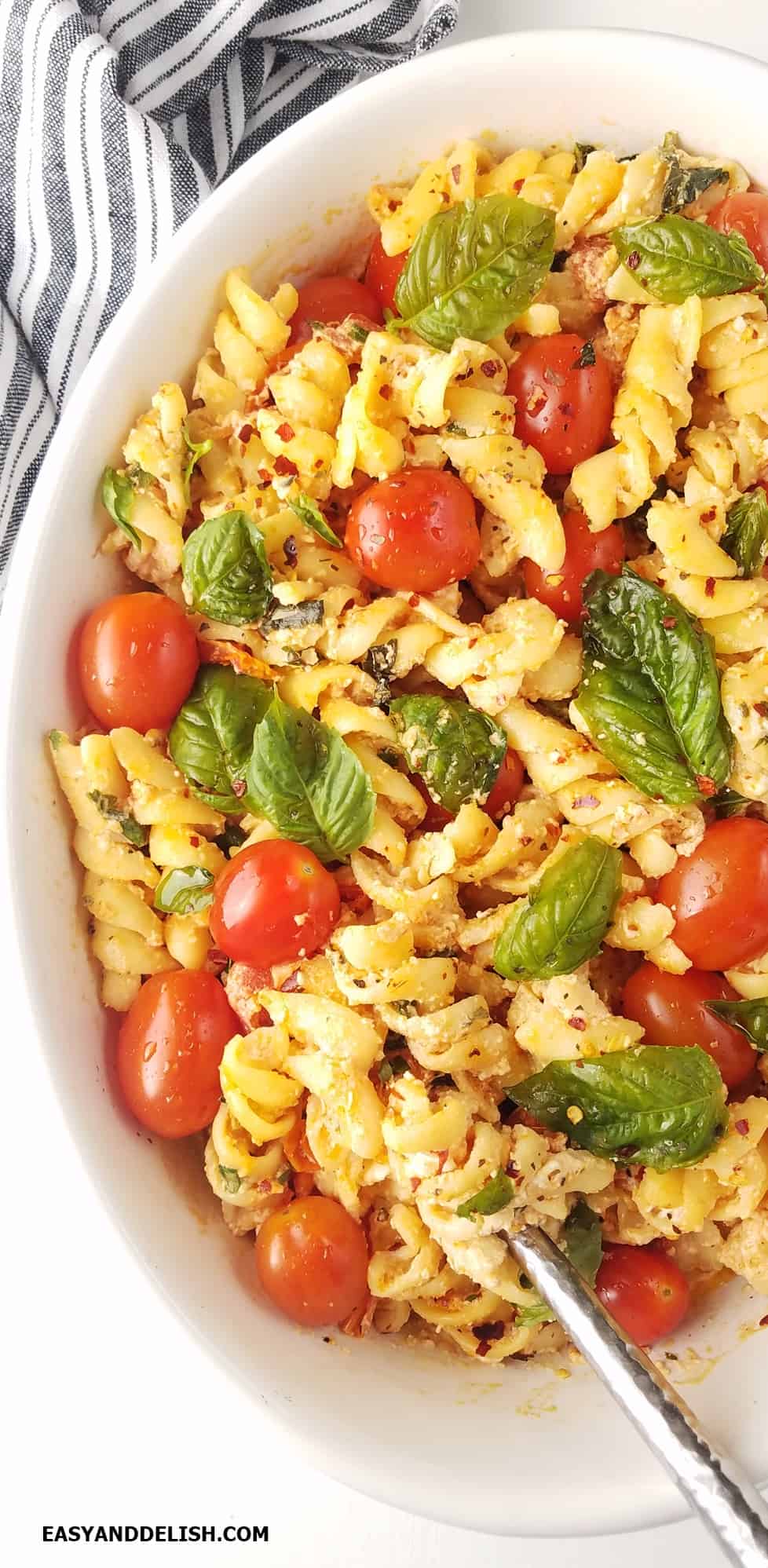 Half baking dish with baked feta pasta.