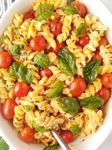 Close up of Baked feta pasta in a baking dish.