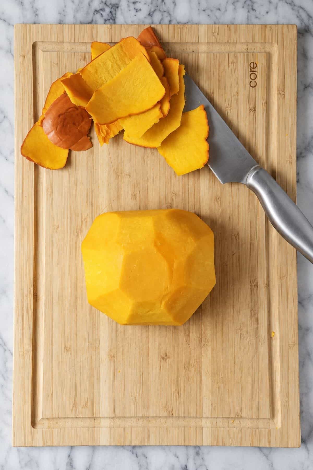 Three views of a pumpkin being cut with a knife, followed by the exposed halves with seeds and stringy pulp.