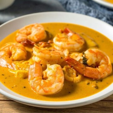 Creamy Sriracha shrimp plated in sauce
