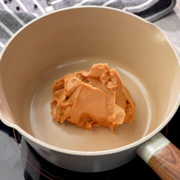 Peanut Butter in a saucepan over medium heat.