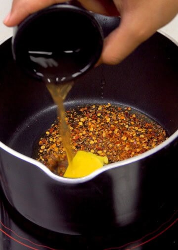 Adding honey, butter, apple cider vinegar and red pepper flakes to create the sauce