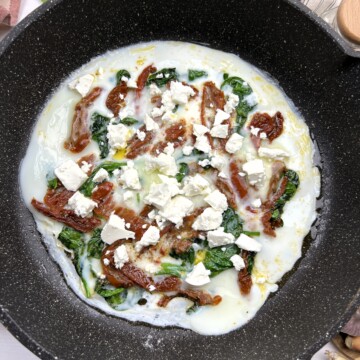 Sprinkle feta cheese evenly over the eggs.