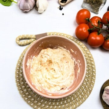 combine cream cheese with sun-dried tomatoes