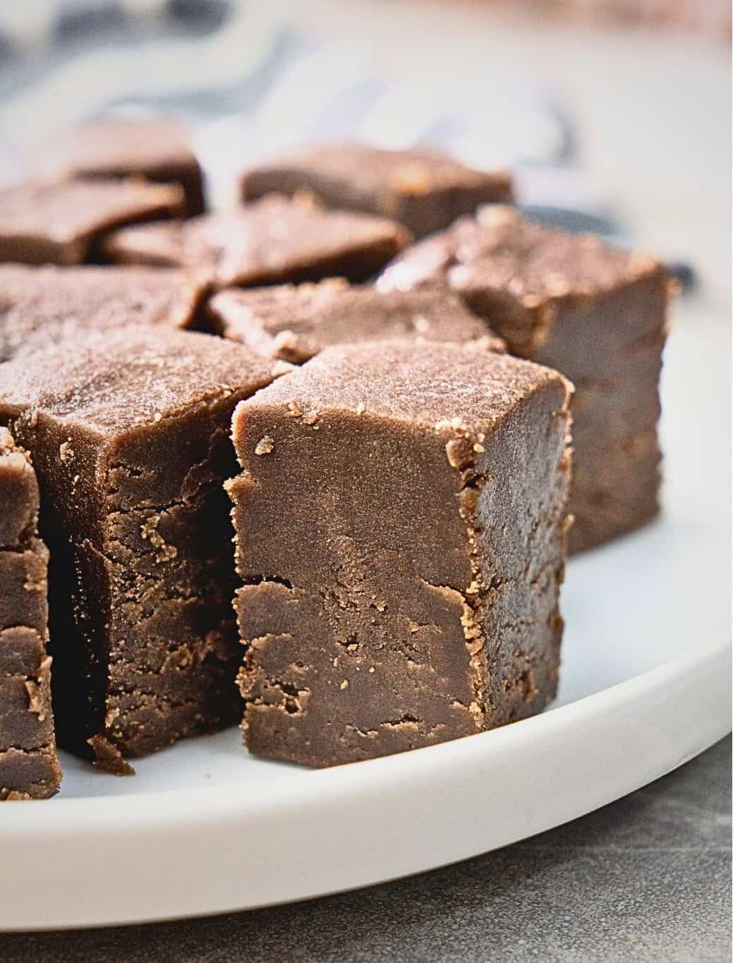 high-protein peanut butter fudge cut into squares on a plate