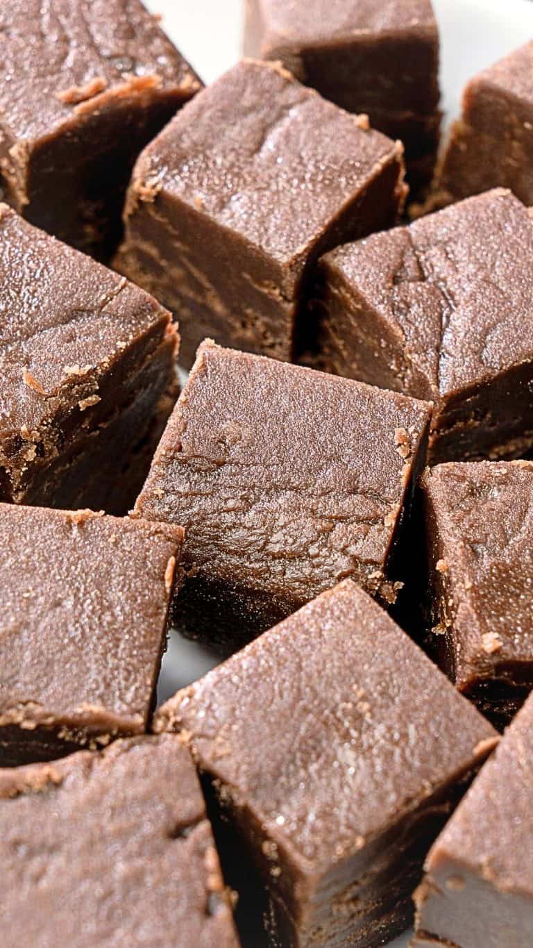 The peanut butter fudge cut into squares on a plate
