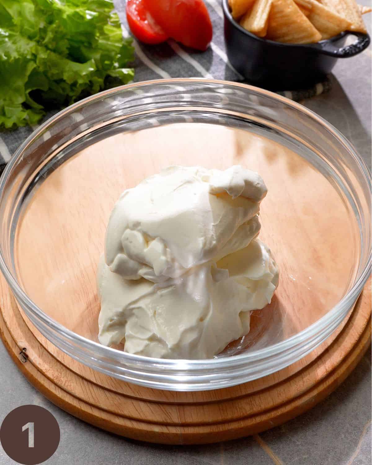 cream cheese sour cream in bowl before mixing.