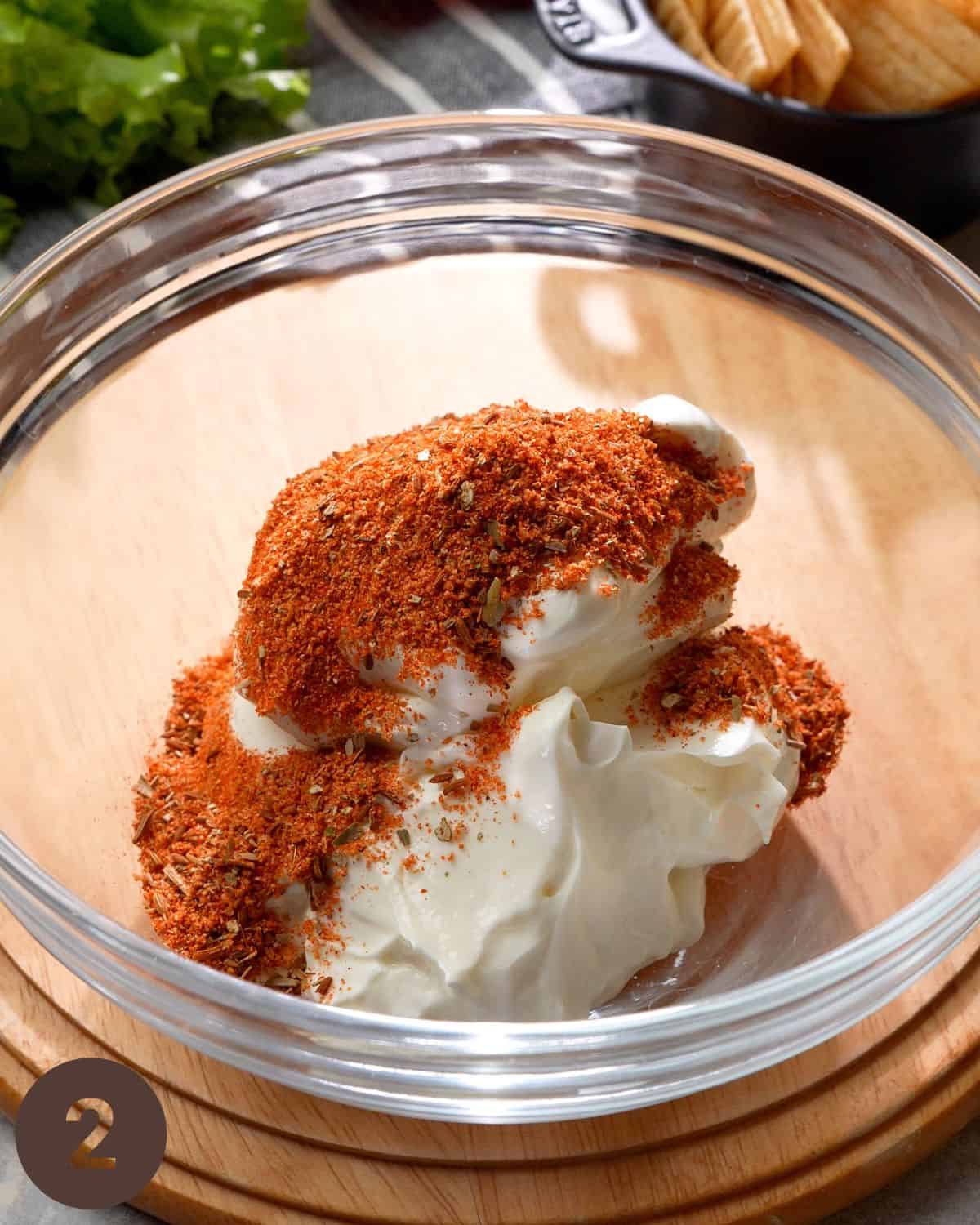 adding taco seasoning in bowl before mixing.