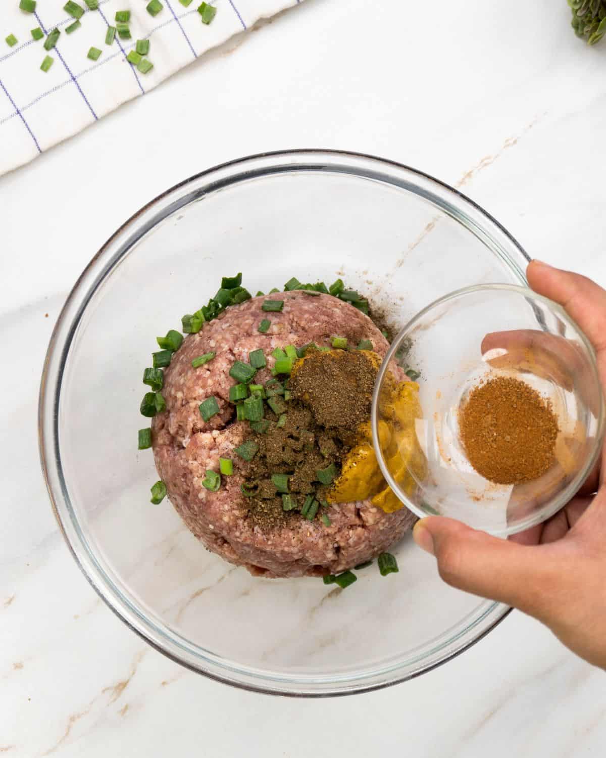 Mixing the beef sausage. 