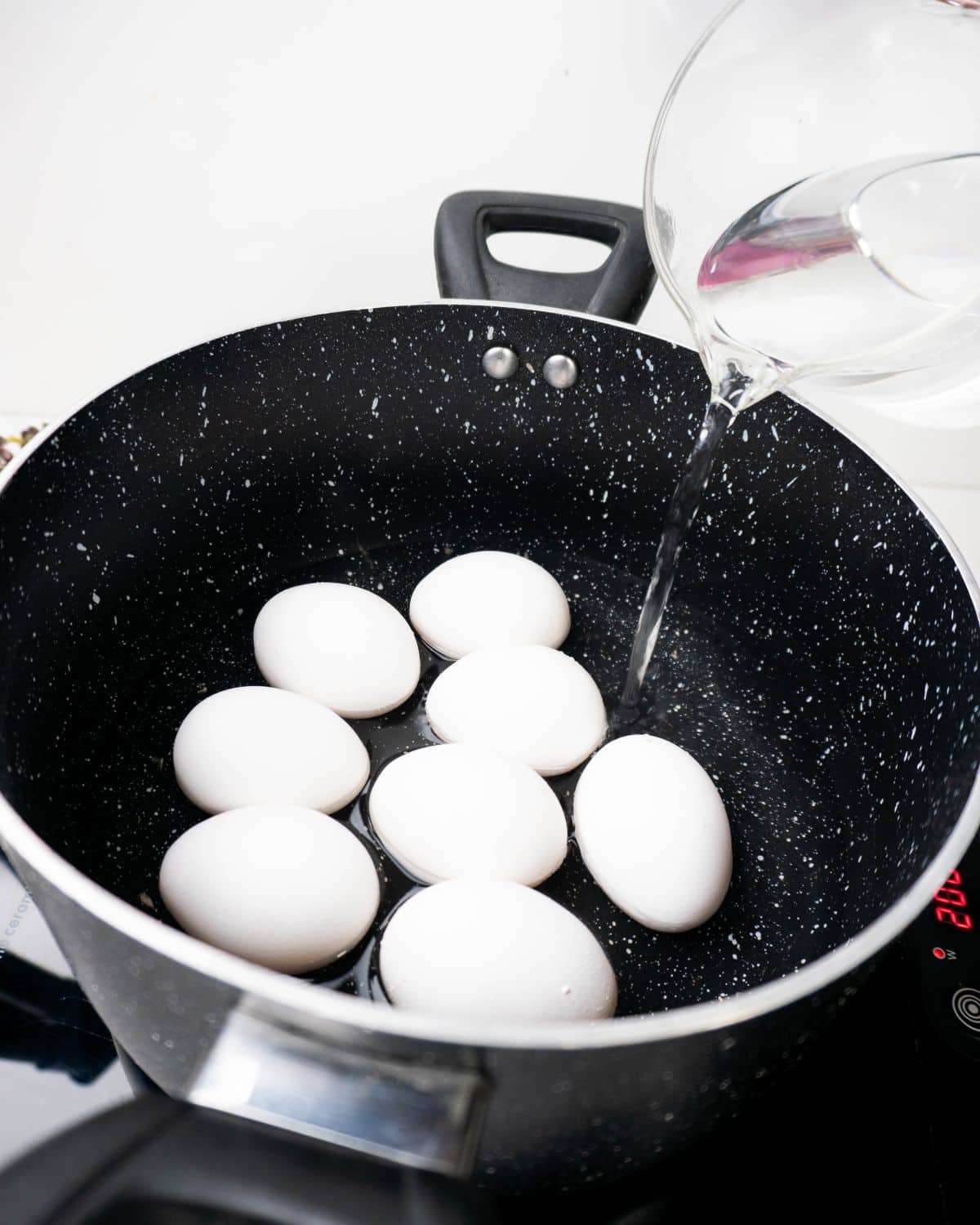 Boiling the eggs for the ground beef Scotch eggs.