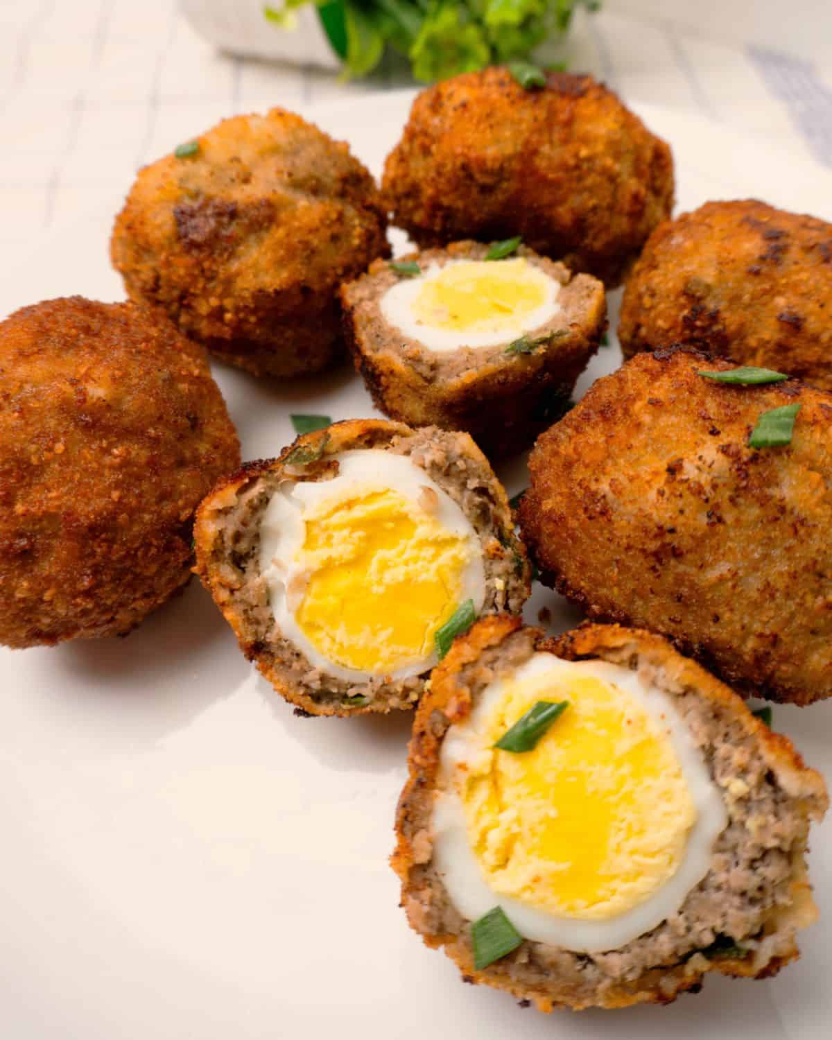 Sliced Scotch eggs in half.