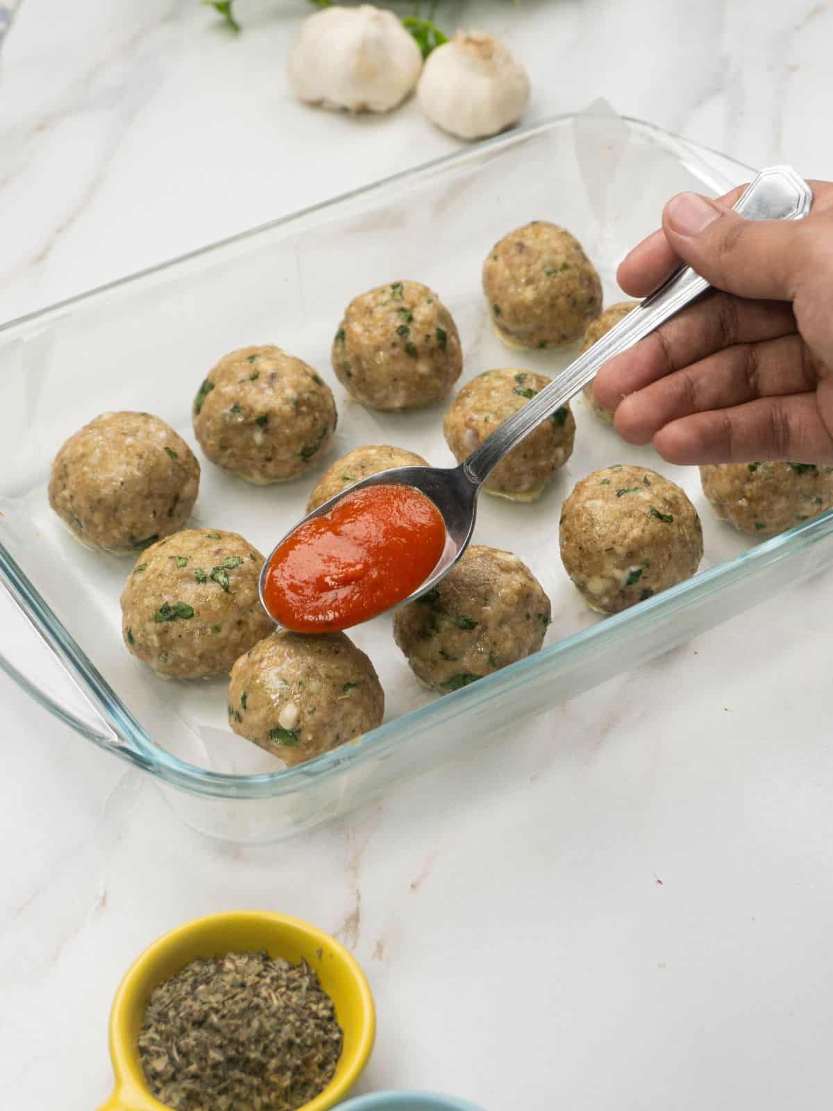 Parmesan meatballs with marinara sauce.