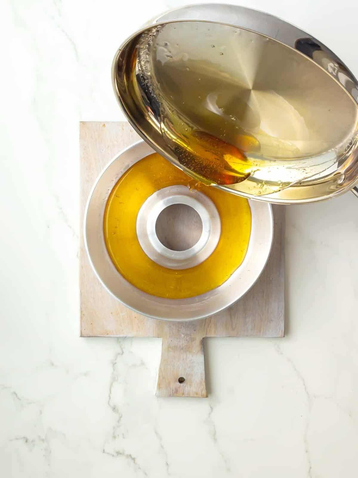 caramel sauce poured into a baking pan.