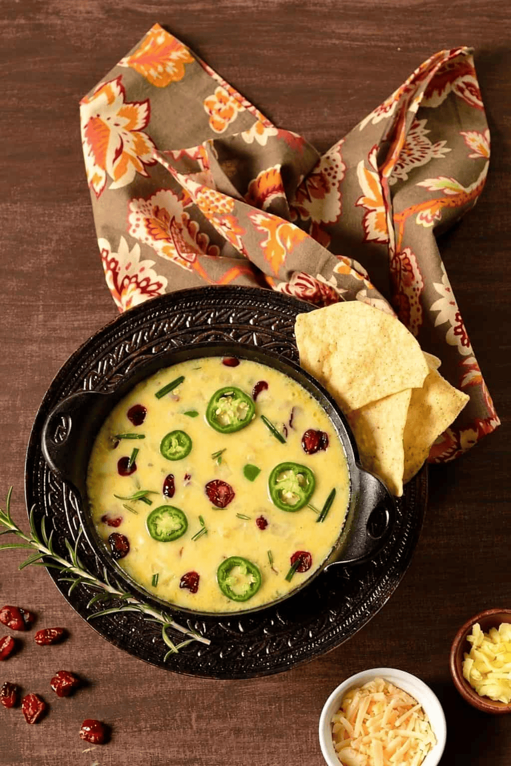 Queso Fundido melted Manchego and queso quesadilla with jalapeños, dried cranberries, and rosemary.